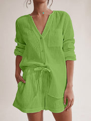 Lime green textured cotton pajama set with drawstring shorts and button-up top.