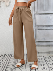 Khaki drawstring wide-leg pants with elastic waistband and pockets.