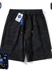 Black men's shorts with all-over playful bear print and drawstring waist.