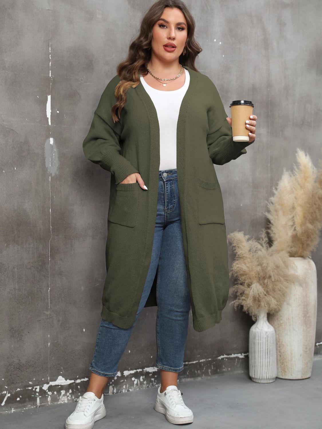 Army green oversized knit duster cardigan with patch pockets and open front.