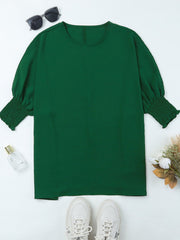 Dark green textured blouse with round neck and elastic cuffs