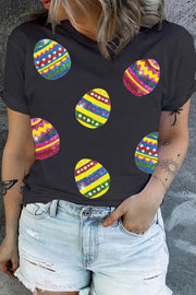 Black crewneck tee with colorful sequin Easter egg appliques.