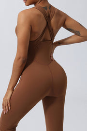 Brown cross-back flare leg unitard with a seamless design and a flattering fit.