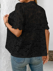 Black floral lace blouse with mandarin collar and scalloped short sleeves.
