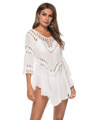 White flowy cover-up with crochet trim neckline and sleeves.