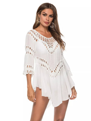 White flowy cover-up with crochet trim neckline and sleeves.