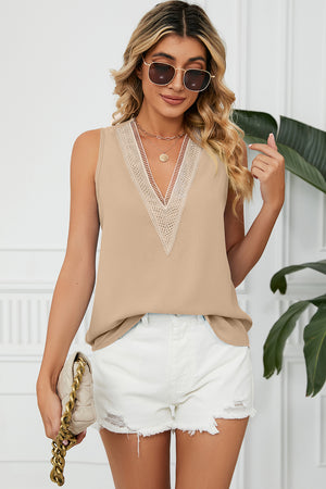 Lace-trimmed V-neck tank top in cream with a relaxed fit.