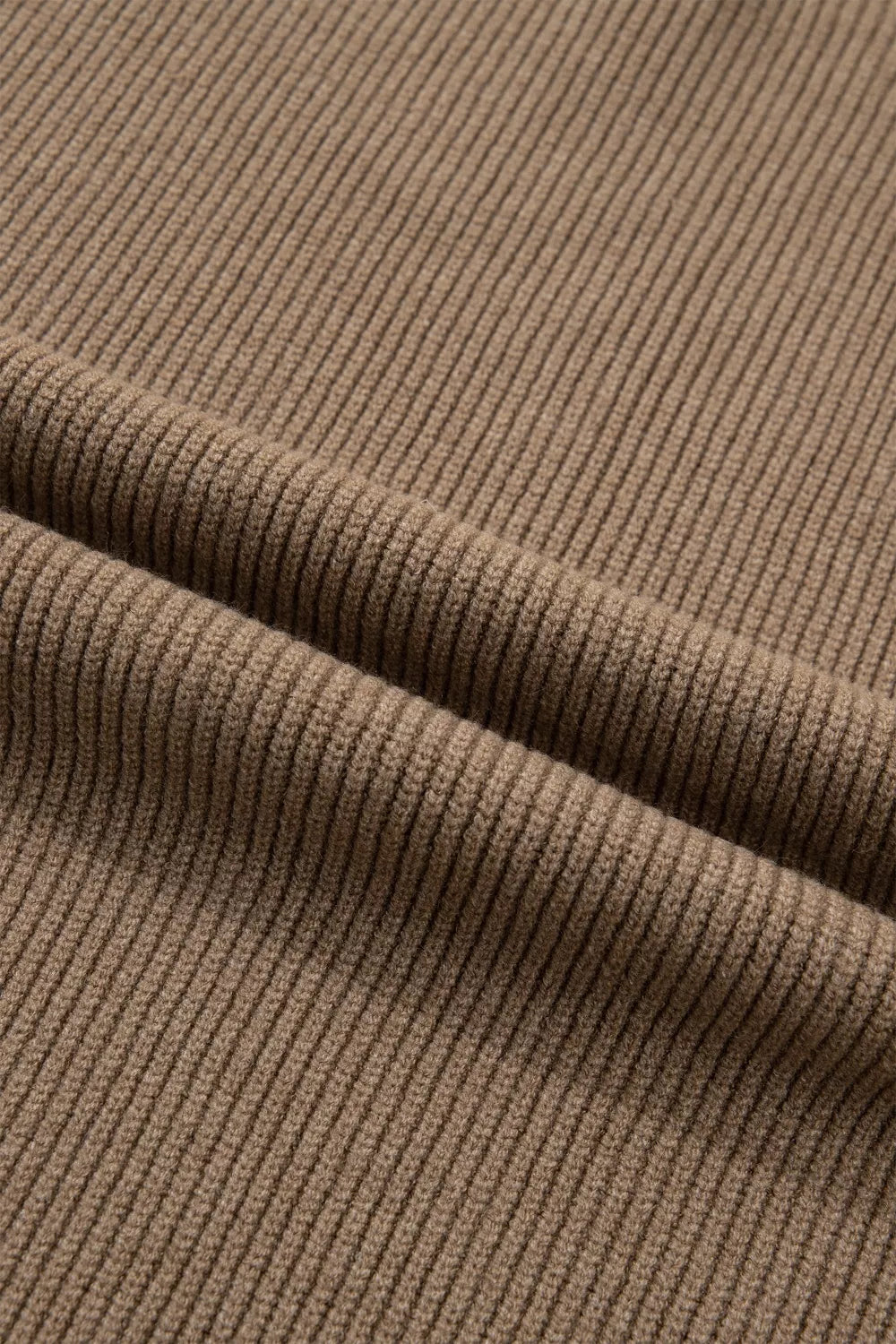 Ribbed knit mock neck sweater vest in brown polyester with a textured finish.