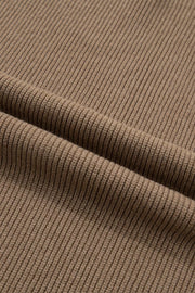 Ribbed knit mock neck sweater vest in brown polyester with a textured finish.