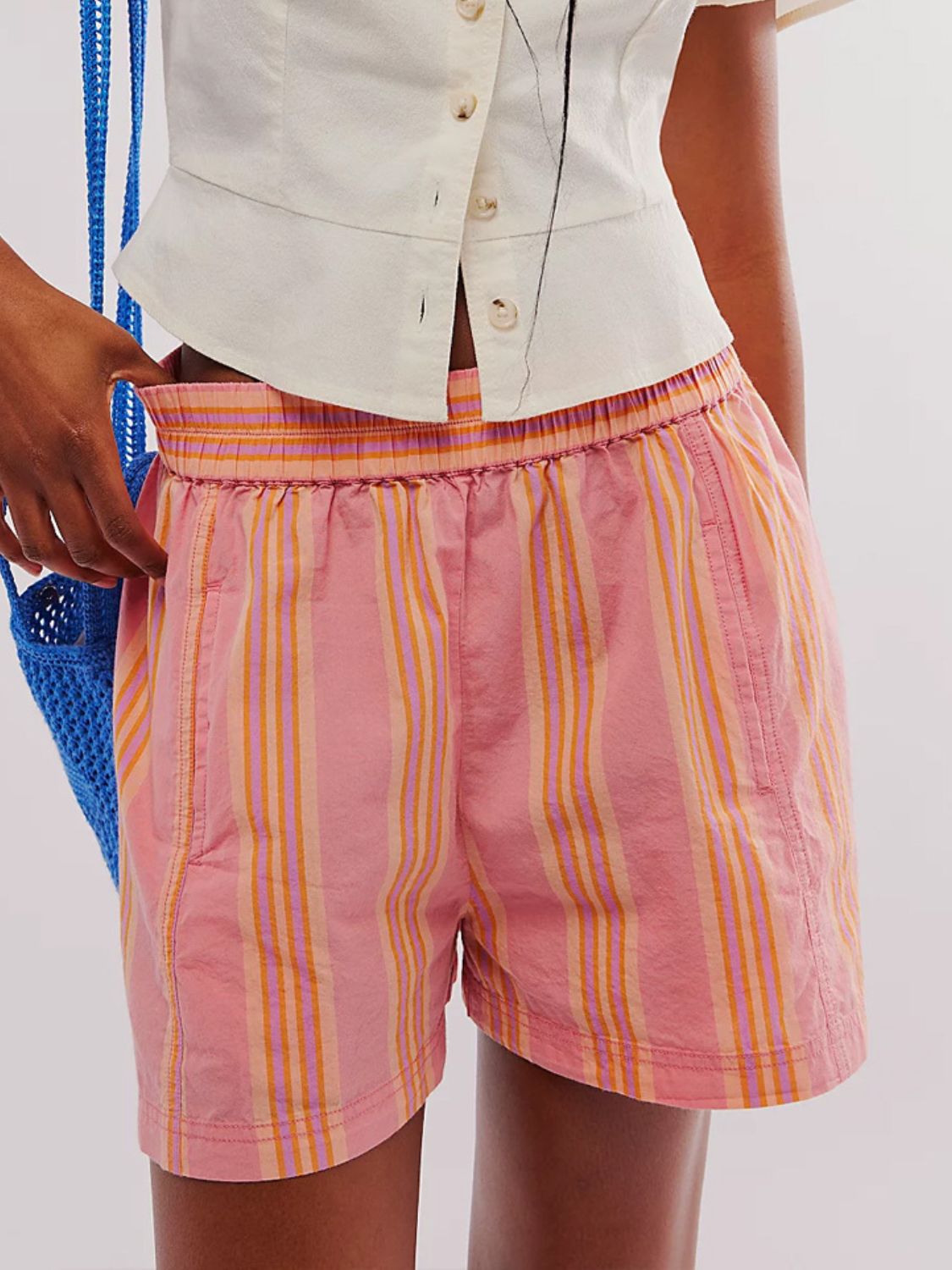 Pink striped shorts with elastic waistband and pockets