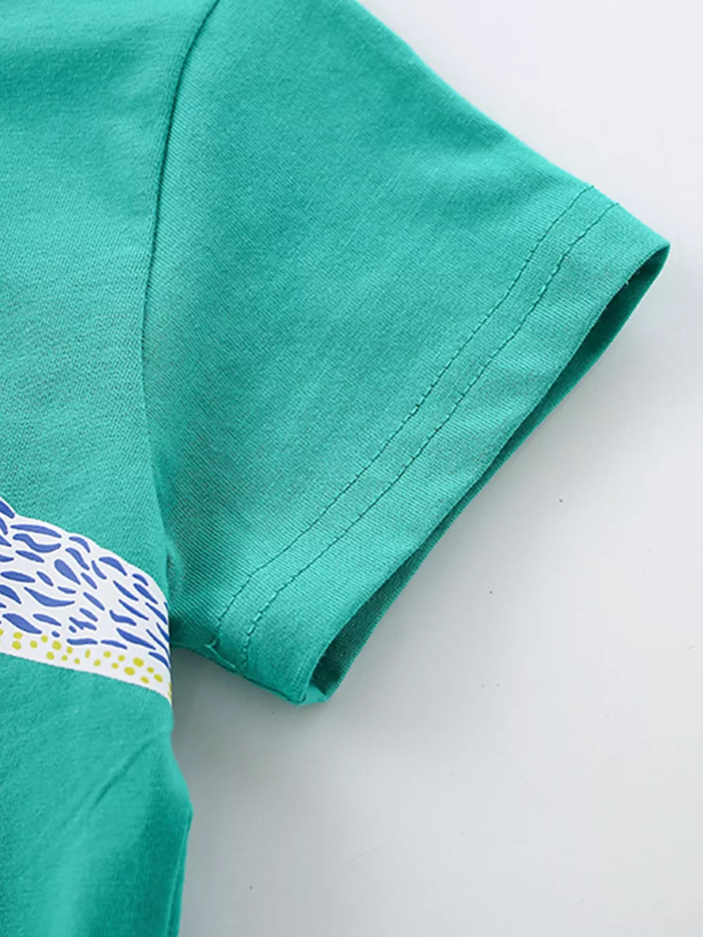 Green cotton t-shirt with short sleeves and a graphic stripe detail.