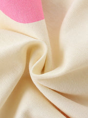 Cream cotton toddler pajamas with pink stripe detail