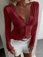Burgundy ribbed buttoned lace trim top with long sleeves and lettuce hem cuffs.