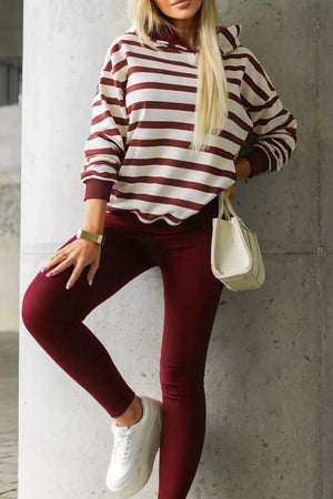 Striped hoodie and leggings set in burgundy and cream, with adjustable drawstring on hoodie.