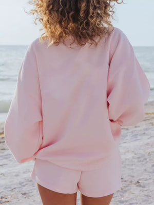 Pink crew neck sweatshirt and matching shorts, a comfortable loungewear set.