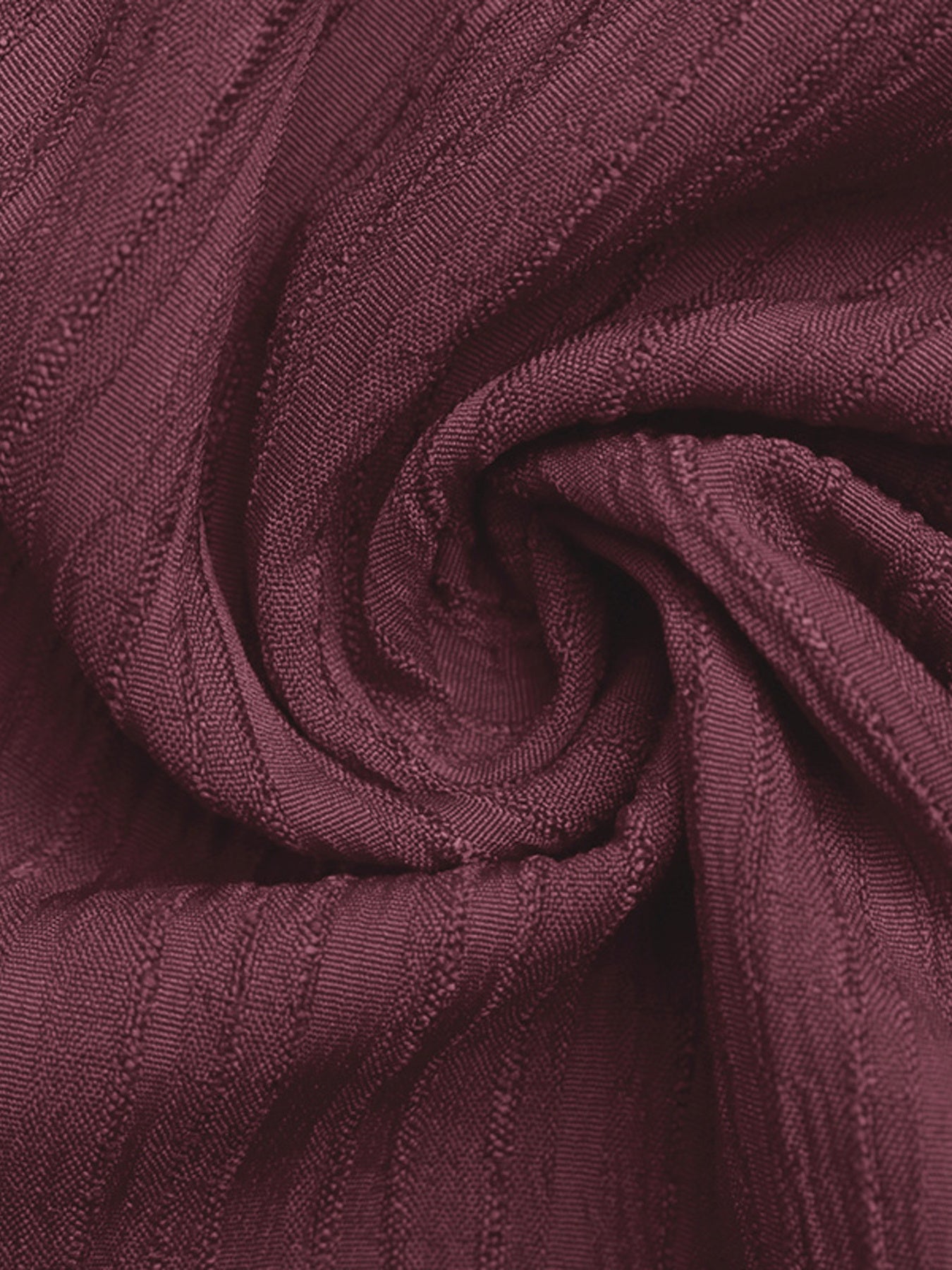 Burgundy textured one-shoulder romper fabric detail