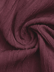 Burgundy textured one-shoulder romper fabric detail