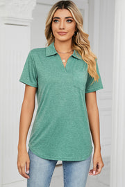 Light green V-neck polo pocket tee with short sleeves.