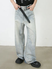 Light faded denim palazzo jeans with relaxed, oversized fit and buttoned closure.