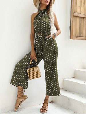 Sage polka dot halter romper with belted waist and wide legs.