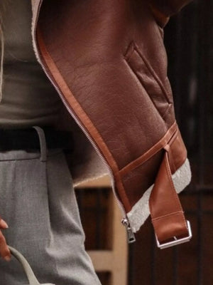 Brown shearling lined zip up jacket with faux leather and buckle detail.