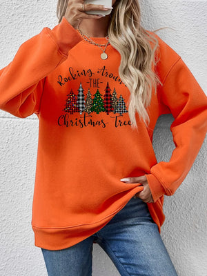 Orange crewneck sweatshirt with graphic Christmas trees and text.