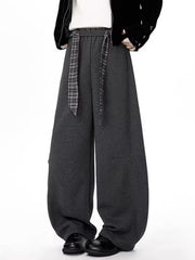 Men's gray relaxed fit wide-leg sweatpants with a plaid tie belt.