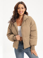 Camel padded bomber jacket with ribbed cuffs and collar, zipped front.