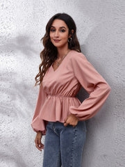 Dusty pink peplum blouse with V-neck and balloon sleeves