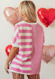 Colorblock stripe waffle knit top in pink and white with crew neck and short sleeves.