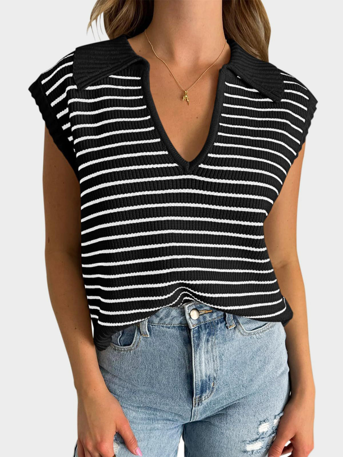 Black and white striped ribbed knit polo vest with a deep V-neck and collar.