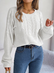 White cable knit drop shoulder pullover sweater with balloon sleeves.