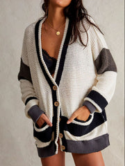 Textured knit cardigan with varsity stripes, button front, and pockets.