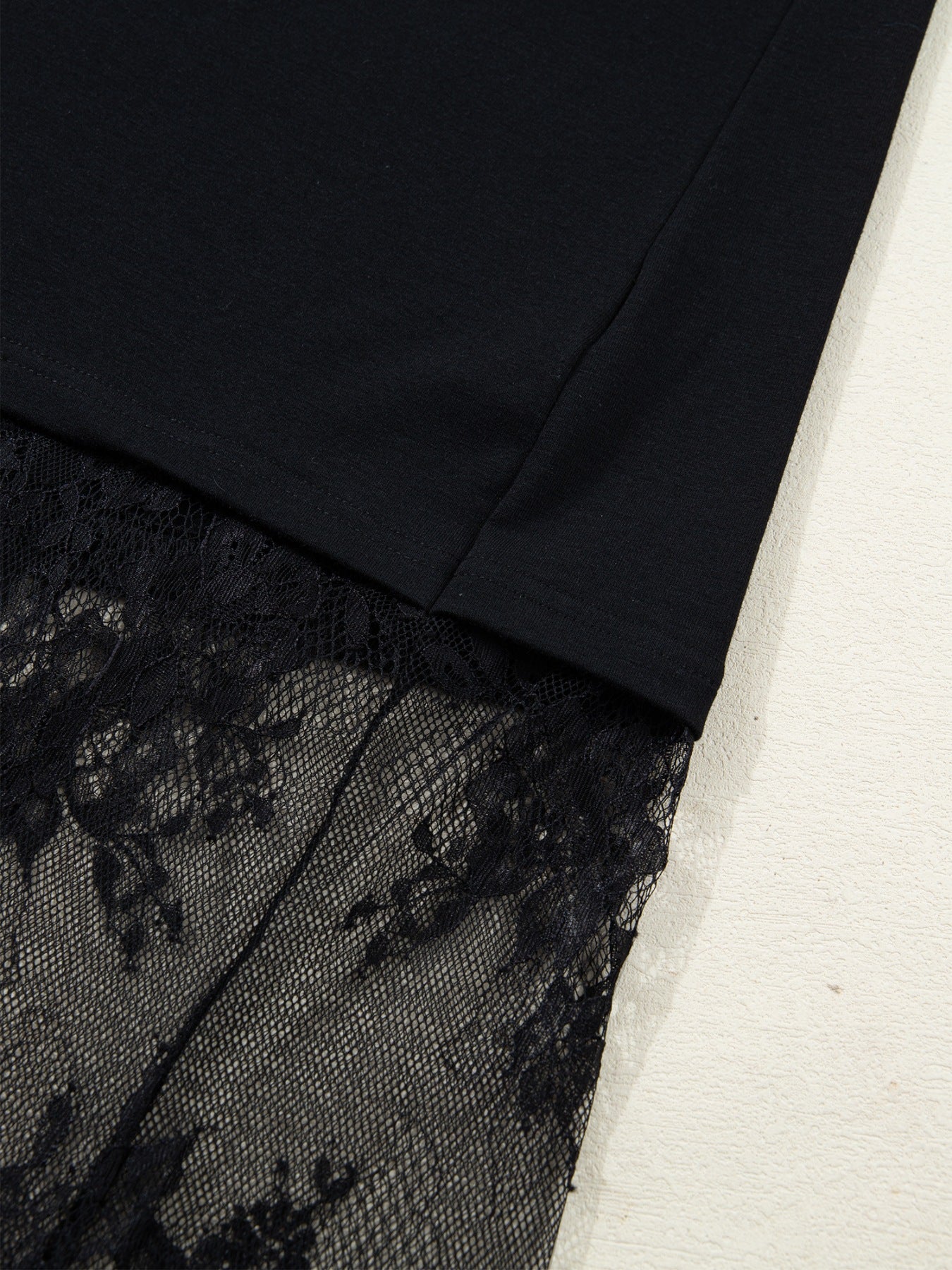 Black maxi dress with floral lace hem detail