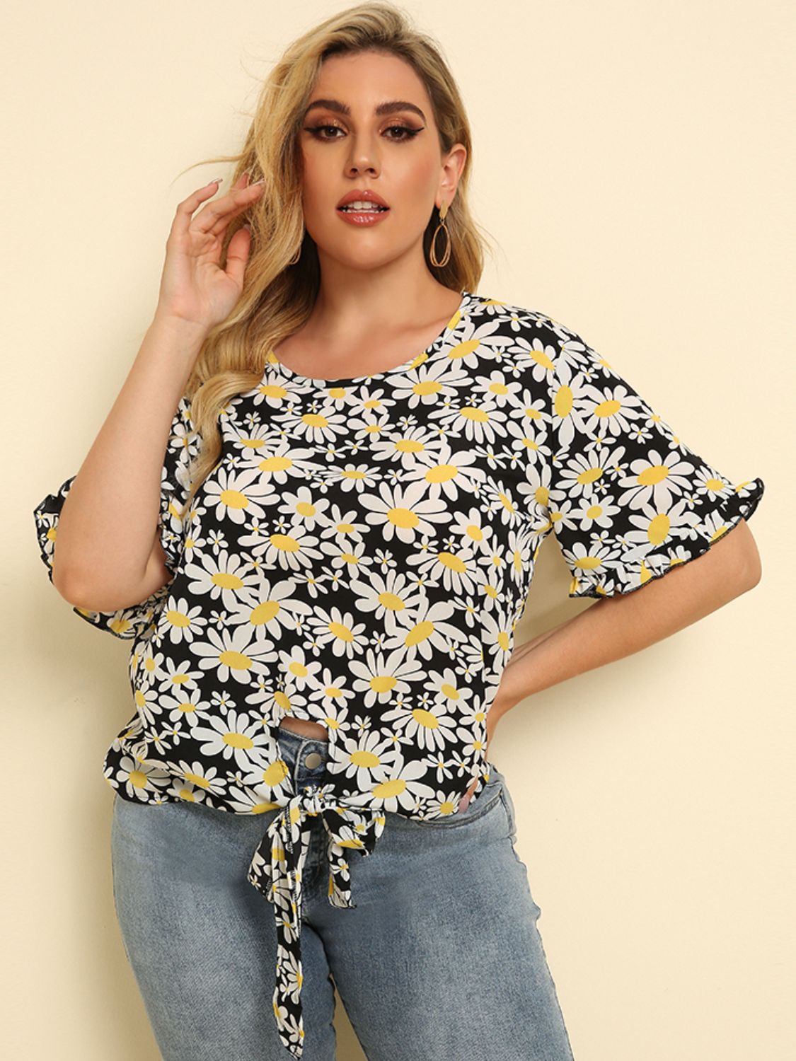 Daisy print blouse with ruffle sleeves and front knot tie
