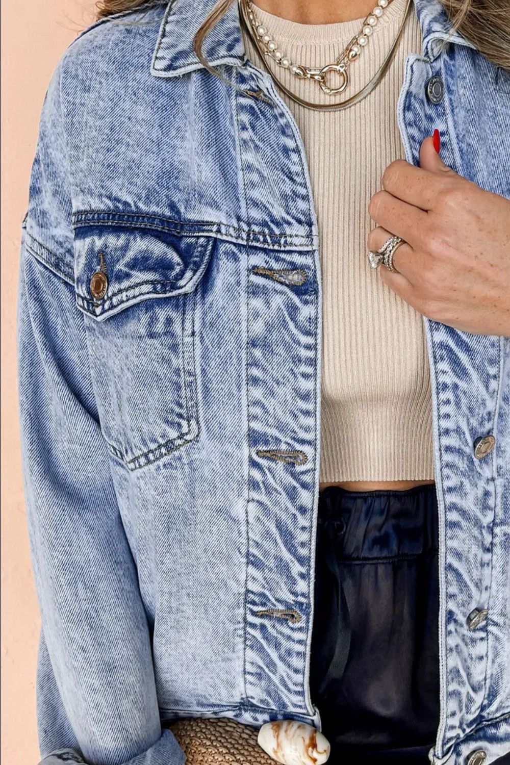 Acid wash denim jacket in medium with relaxed fit and button front.