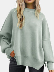 Mint green ribbed knit sweater with slouchy sleeves and mock neck.