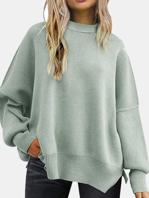Mint green ribbed knit sweater with slouchy sleeves and mock neck.
