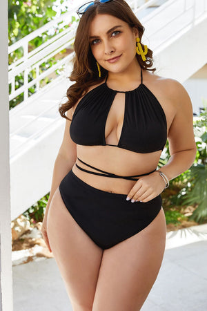 Black halter bikini with keyhole cutout top and high-waist bottoms with tie detail