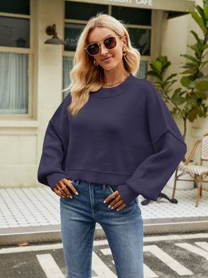 Cobalt blue acrylic dropped shoulder knit sweater with balloon sleeves.