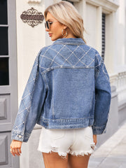 Dusty blue denim trucker jacket with diamond stitch pearl and rhinestone detailing on back and sleeves.