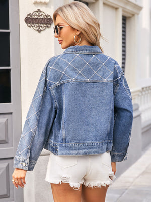 Dusty blue denim trucker jacket with diamond stitch pearl and rhinestone detailing on back and sleeves.