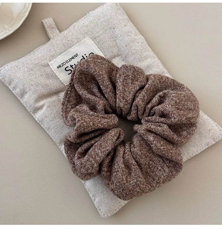 Textured knit scrunchie in Style A brown, a comfortable hair accessory.