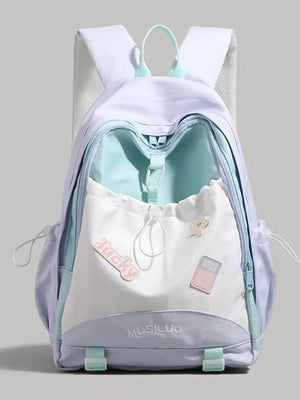 Contrasting accent drawstring backpack in white and pastel purple with teal trim and cute patches.