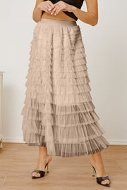 Tiered tulle maxi skirt in ivory with ruffled layers and a comfortable elastic waistband.