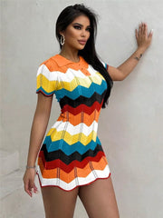 Zigzag knit short sleeve sweater dress with collar and button detail in multicolor chevron pattern.