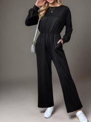 Black long sleeve wide leg jumpsuit with elastic waist and pockets