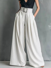 Belted high-waisted wide-leg pants in white with a decorative buckle, styled with a black top.