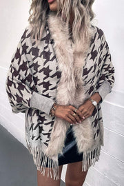 Houndstooth faux fur collar poncho with fringe detail in beige and dark brown.
