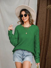 Green diamond-cut raglan knit sweater with crew neck and long sleeves.